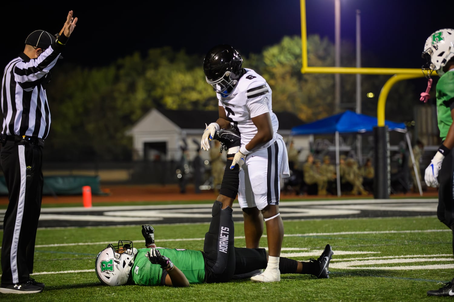 Good sportsmanship is alive and well during the Alpharetta at Roswell football game, November 3, 2023. (Jamie Spaar for the Atlanta Journal Constitution)