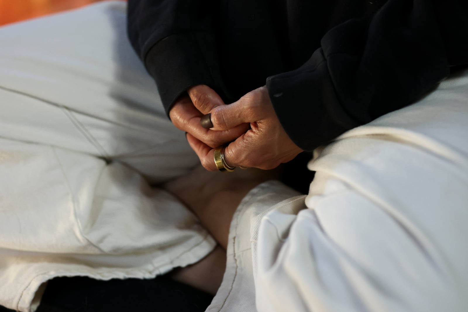 A detail view of the hands of Headspace meditation teacher, Rosie Acosta, is seen as she meditates in her studio Monday, Sept. 30, 2024, in Woodland Hills, Calif. (AP Photo/Jessie Alcheh)