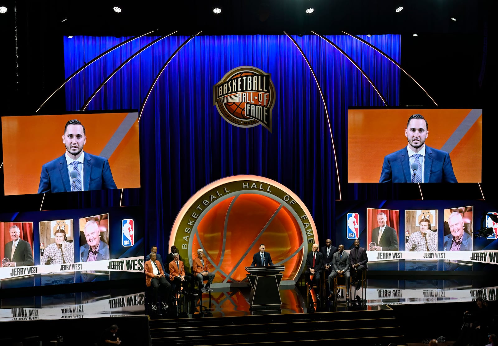 Jonnie West, center, speaks during his late father Jerry West's enshrinement in the Basketball Hall of Fame, Sunday Oct. 13, 2024, in Springfield, Mass. (AP Photo/Jessica Hill)