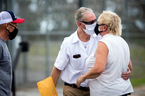 Dennis Perry is greeted by his wife Brenda Perry in front of the Coffee Correctional Facility, Thursday, July 23, 2020, in Nicholls, Ga. Perry was released after being behind bars for 20 years. (Stephen B. Morton for The Atlanta Journal-Constitution)