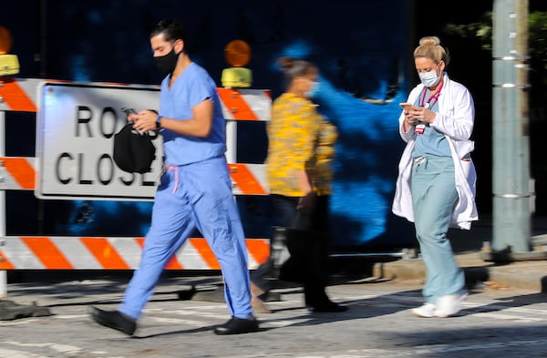 File photo of medical workers move between buildings at Grady Memorial Hospital in downtown Atlanta. (John Spink / John.Spink@ajc.com)

