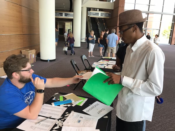 De'Nico Davis, 19, a gospel singer, came in from Montgomery, Ala. to try out. He picked up paperwork from production assistant Martin Torchia.