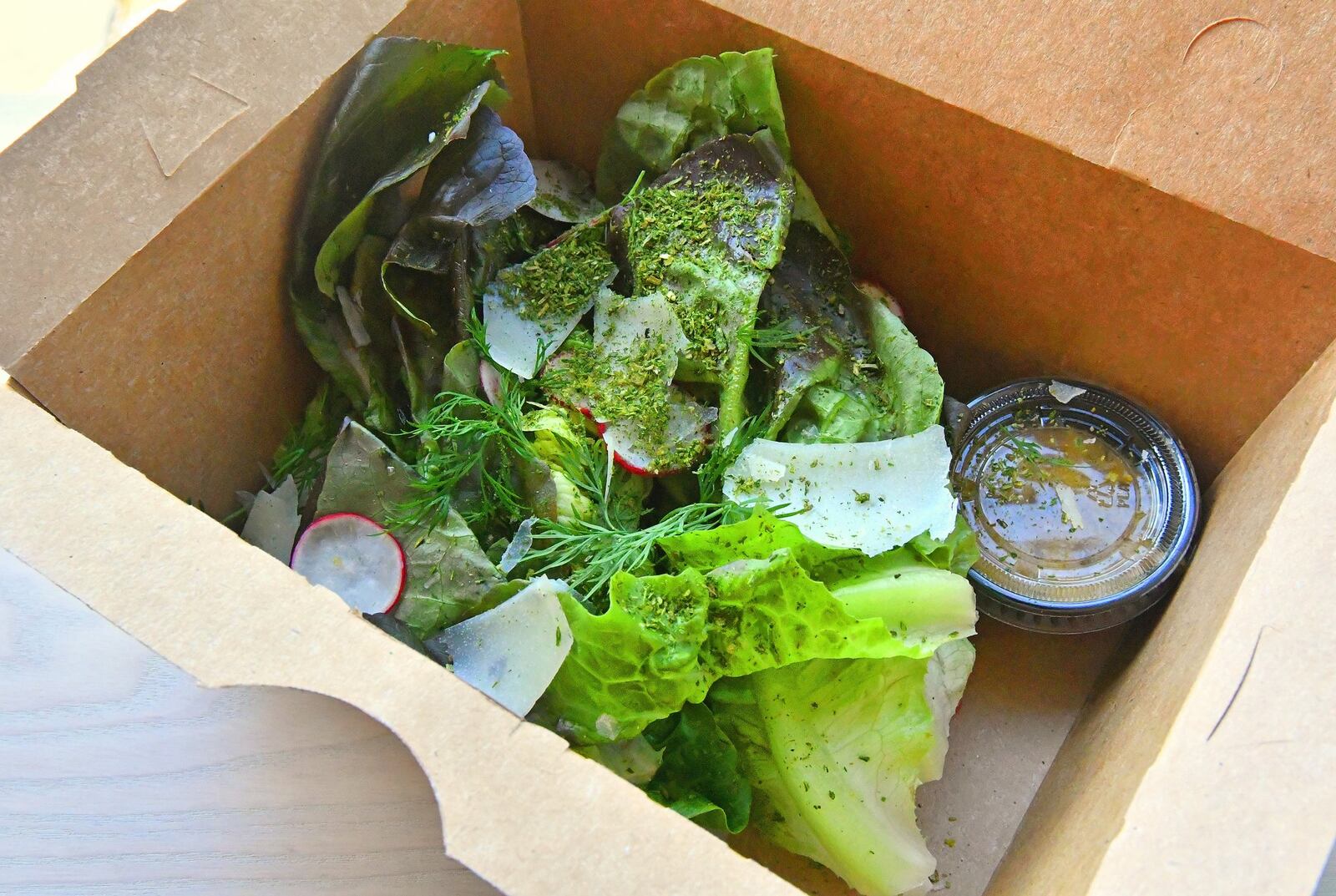 Gem lettuce al pil pil  salad tossed with Basque style emulsified aromatic olive oil sauce, topped with Idiazabal cheese, 'Tammy the sourdough' gremolata and tons of dill. CONTRIBUTED BY CHRIS HUNT PHOTOGRAPHY)