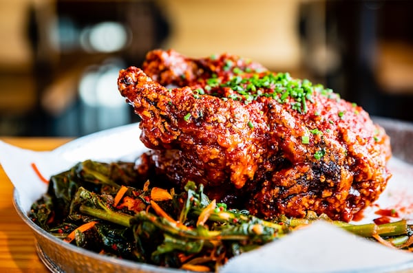 Boxcar's Korean Fried Chicken is fried whole and served coated in a spicy, savory Gochujang sauce. CONTRIBUTED BY HENRI HOLLIS