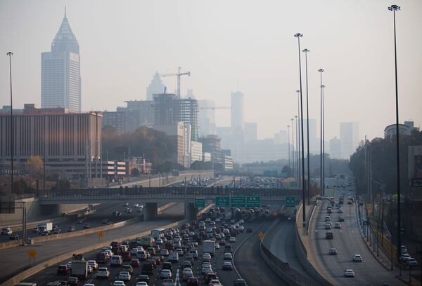 A haze hovers over the downtown skyline from a wildfire burning in the Northwest part of the state, Monday, Nov. 14, 2016, in Atlanta. Fires, many of them suspected arsons, have prompted evacuations in Georgia, North Carolina and Tennessee recently. (AP Photo/David Goldman)