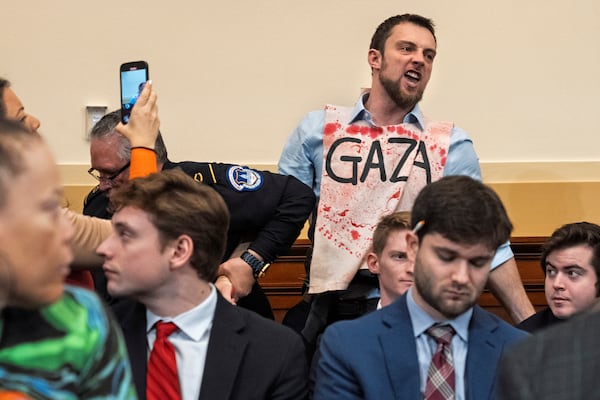 A Gaza protester screams at Secretary of State Antony Blinken as he testifies during a House Committee on Foreign Affairs hearing on the US withdrawal from Afghanistan, Wednesday, Dec. 11, 2024, on Capitol Hill in Washington. (AP Photo/Jacquelyn Martin)