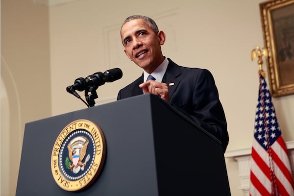 President Barack Obama makes  a statement on the climate agreement in the Cabinet Room of the White House on December 12, 2015 in Washington, DC.  Obama described the accord as the best chance to save the planet.