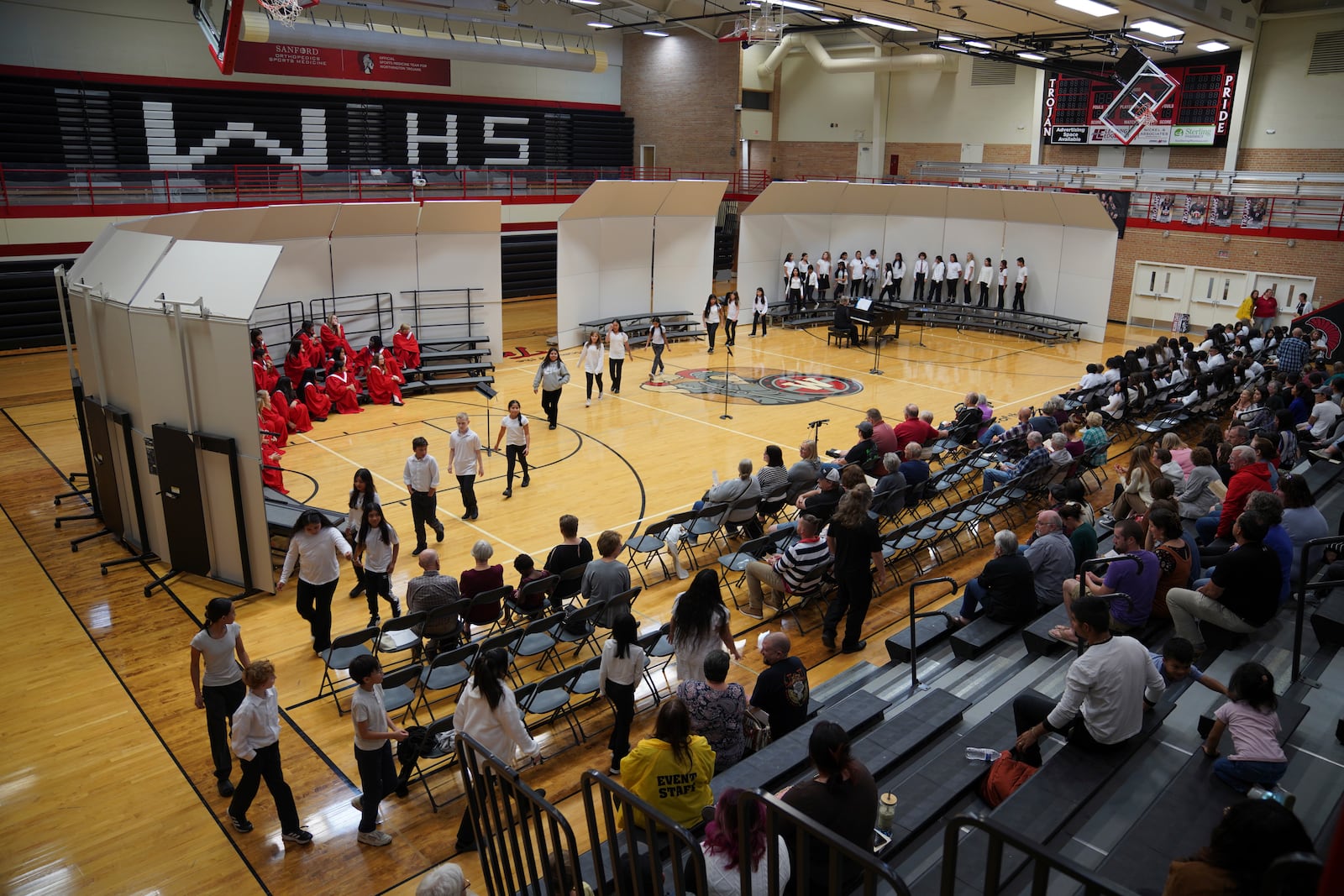 Middle school and high school students perform a choir concert at Worthington High School, in Worthington, Minn., on Monday, Oct. 21, 2024. (AP Photo/Jessie Wardarski)