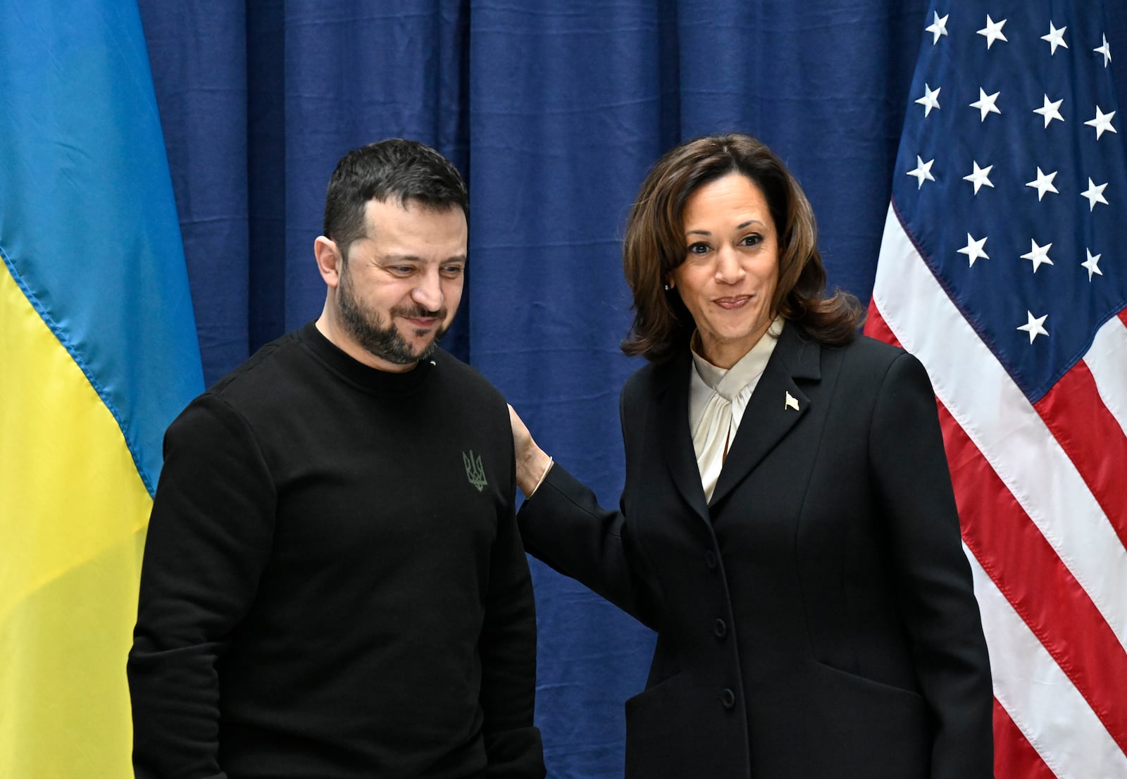 FILE - Ukrainian President Volodymyr Zelenskyy, left, and U.S. Vice President Kamala Harris pose for pictures at the end of a news conference at the Munich Security Conference in Munich, Germany, on Feb. 17, 2024. (Tobias Schwarz/Pool via AP, File)