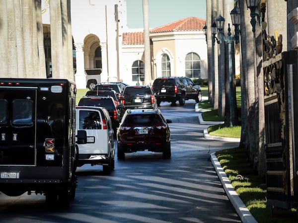 President Donald Trump's motorcade enters Trump International Golf Club in West Palm Beach Sunday morning, December 31, 2017. (Bruce R. Bennett / The Palm Beach Post)