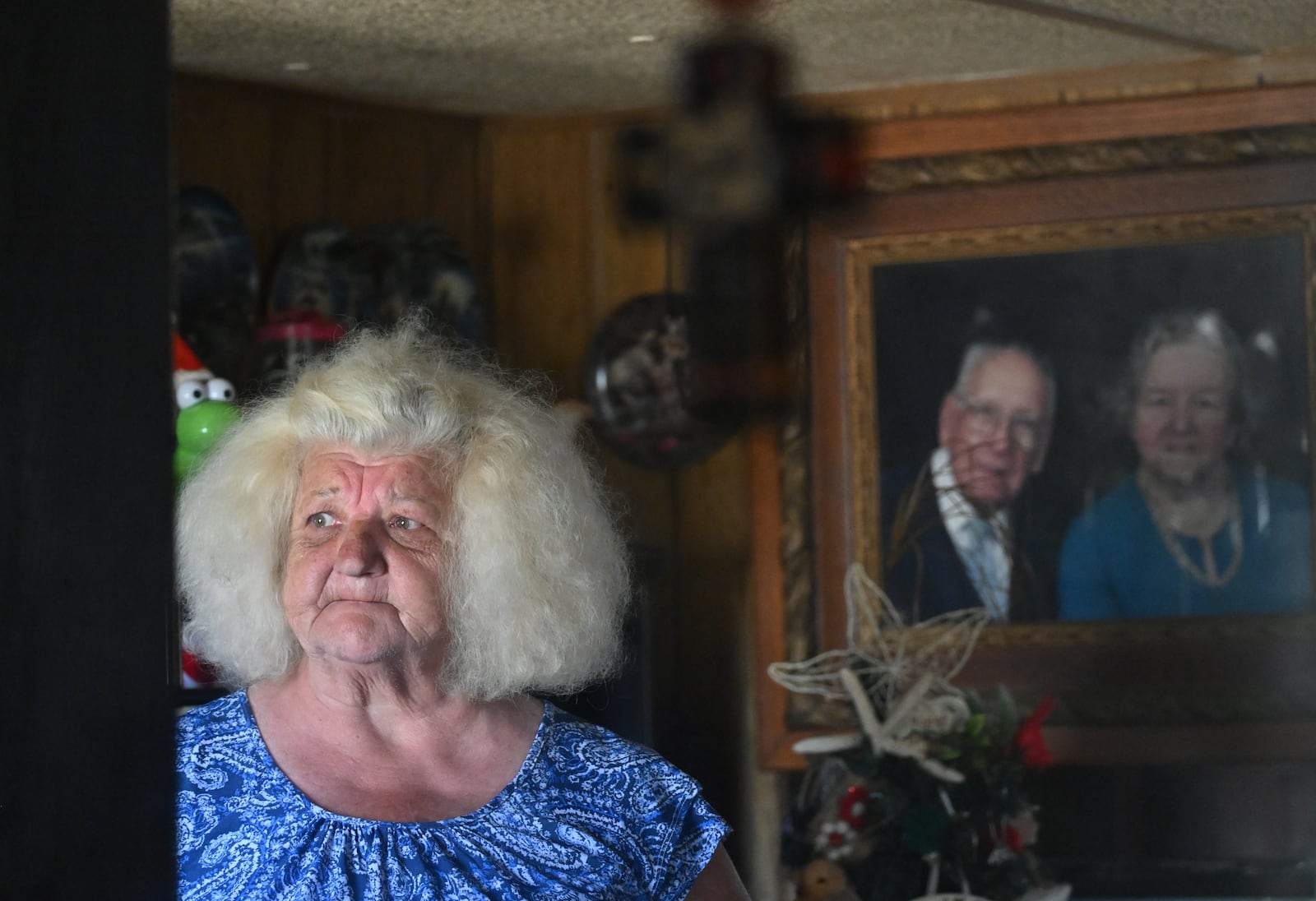 Kathy Hauner becomes emotional as she recalls the day she got her power back inside her mobile home, outside Uvalda in Montgomery County, after it was severely damaged by Hurricane Helene. (Hyosub Shin/AJC)