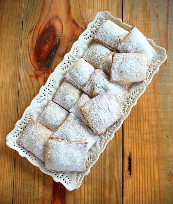 Cuscini di Gesú Bambino (Baby Jesus Pillows) are turnovers filled with pureed chickpeas and chocolate. STYLING BY CATERINA SCARANO / CONTRIBUTED BY CHRIS HUNT PHOTOGRAPHY