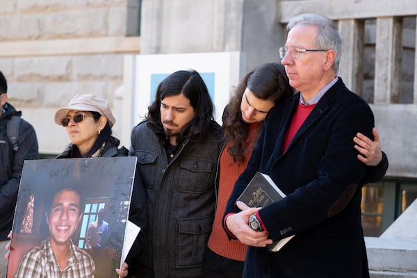 230313-Decatur-Manuel ÒTortuguitaÓ TeranÕs mother Belkis Teran, from left, brother Daniel Paez, brother Pedro Santema and father Joel Paez listen to their attorney speak during a press conference Monday, March 13, 2023, in Decatur to release the results of an autopsy they commissioned. Ben Gray for the Atlanta Journal-Constitution