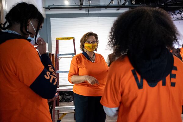 Deborah Scott, executive director of Georgia STAND-UP, talks with newly trained canvassers before they hit the streets Wednesday morning, Dec. 2, 2020.  Ben Gray for The Atlanta Journal-Constitution