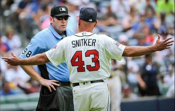 It was a blistering hot day Sunday when the Braves got pounded 13-2 by the Cubs. Tempers flared after a questionable call or two. (Getty Images photo)