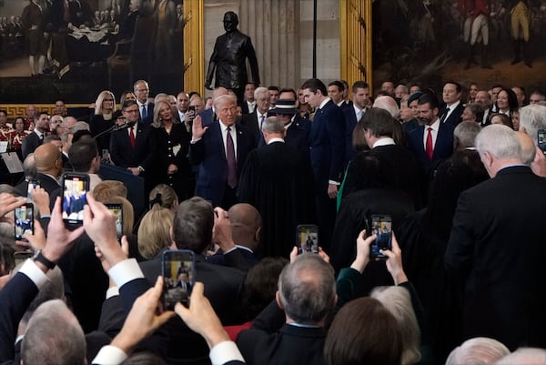 Donald Trump is sworn in as the 47th president of the United States by Chief Justice John Roberts as Melania Trump holds the Bible during the 60th Presidential Inauguration in the Rotunda of the U.S. Capitol in Washington, Monday, Jan. 20, 2025. (AP Photo/Julia Demaree Nikhinson, Pool)