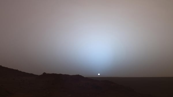 On May 19th, 2005, NASA's Mars Exploration Rover Spirit captured this stunning view as the sun sank below the rim of Gusev crater on Mars. In this image, the bluish glow in the sky above the sun would be visible to us if we were there, but an artifact of the Pancam's infrared imaging capabilities is that with this filter combination the redness of the sky farther from the sunset is exaggerated compared to the daytime colors of the Martian sky.