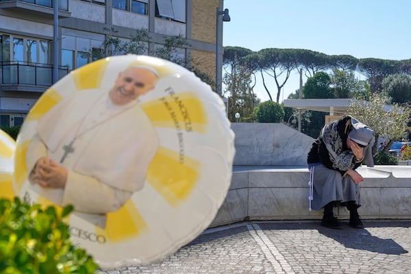 A nun prays outside the Agostino Gemelli Polyclinic where Pope Francis is hospitalized in Rome, Monday, March 3, 2025. (AP Photo/Gregorio Borgia)