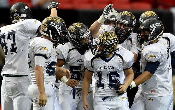 Eagles Landing Christian Academy kicker Alex Usry (16) is congratulated after kicking a field goal in the Class A- Private state finals. (Brant Sanderlin/AJC)