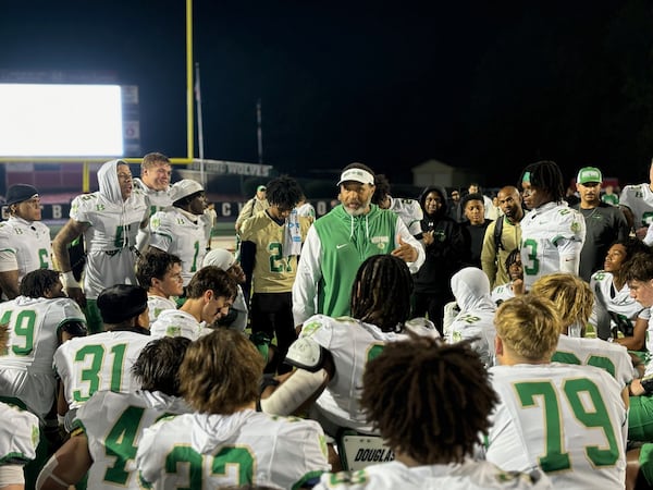 Buford High School football coach Bryant Appling talks to his team after a recent win.