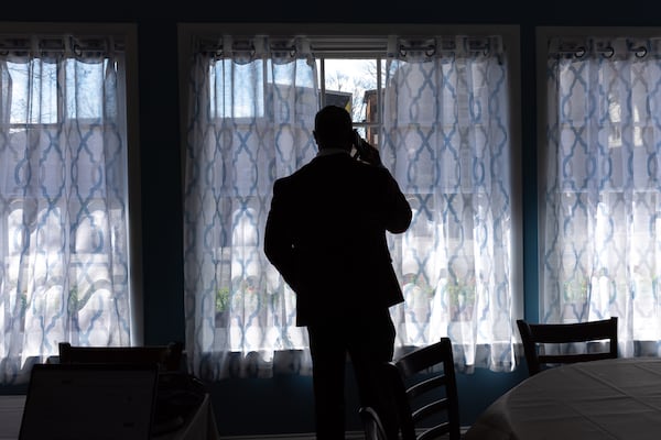 A person looks out the window in the newly reopened Skyline Room at Mary Mac’s restaurant in Atlanta on Thursday, February 20, 2025. The Skyline Room was heavily damaged by a collapsed roof after heavy rain in 2024. (Arvin Temkar / AJC)