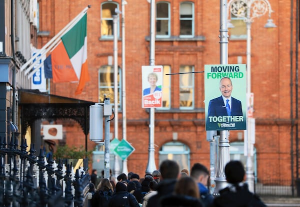 Irish election posters hang from lampposts in Dublin City centre, Tuesday, Nov. 26, 2024, ahead of Ireland's election on Friday. (AP Photo/Peter Morrison)