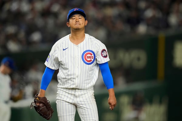 Chicago Cubs' Shota Imanaga walks around the mound after walking Los Angeles Dodgers' Teoscar Hernandez in the fourth inning of an MLB Japan Series baseball game in Tokyo, Japan, Tuesday, March 18, 2025. (AP Photo/Hiro Komae)