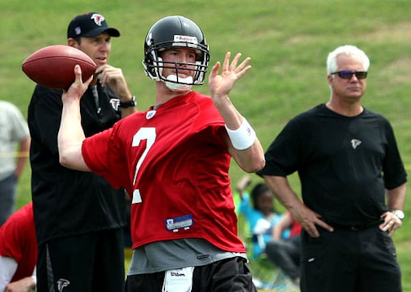 Falcons coach Mike Smith (right) and offensive coordinator Mike Mularkey got a good look at their new investment, quarterback Matt Ryan, at his first Falcons minicamp.