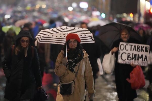 People march during a protest following the collapse of a concrete canopy at the railway station in Novi Sad that killed 14 people, in Belgrade, Serbia, Monday, Nov. 11, 2024. (AP Photo/Darko Vojinovic)