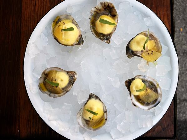 The chef's set of oysters topped beautiful shellfish with watermelon radish and a citrusy agua fresca foam.