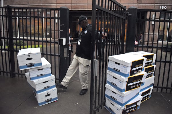 February 12, 2019 Atlanta - In order to clear a pathway outside the Atlanta Immigration Court, a gaurd kicks aside several boxes with more than 445,000 petition signatures demanding the release of 21 Savage. U.S. Immigration and Customs Enforcement arrested the Grammy-nominated rapper the morning of February 3, claiming that he is actually from the United Kingdom and overstayed his visa. Ten organizations, including Color Of Change, delivered more than 445,000 petition signatures demanding the release of 21 Savage. RYON HORNE / RHORNE@AJC.COM