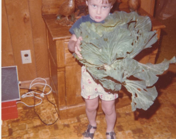 Mark Capps of Straight From the Backyard Farm is seen at age 4 with one of his first homegrown cabbages. Courtesy of Mark Capps