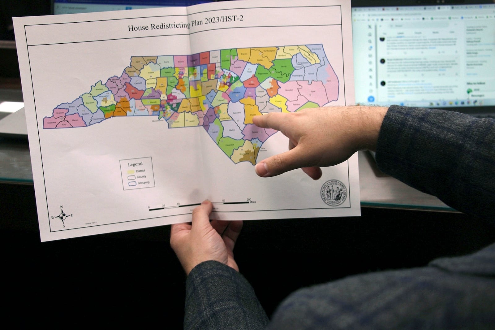 FILE - The North Carolina state House reviews copies of a map proposal for new state House districts during a committee hearing at the Legislative Office Building in Raleigh, N.C., Thursday, Oct. 19, 2023. (AP Photo/Hannah Schoenbaum, File)