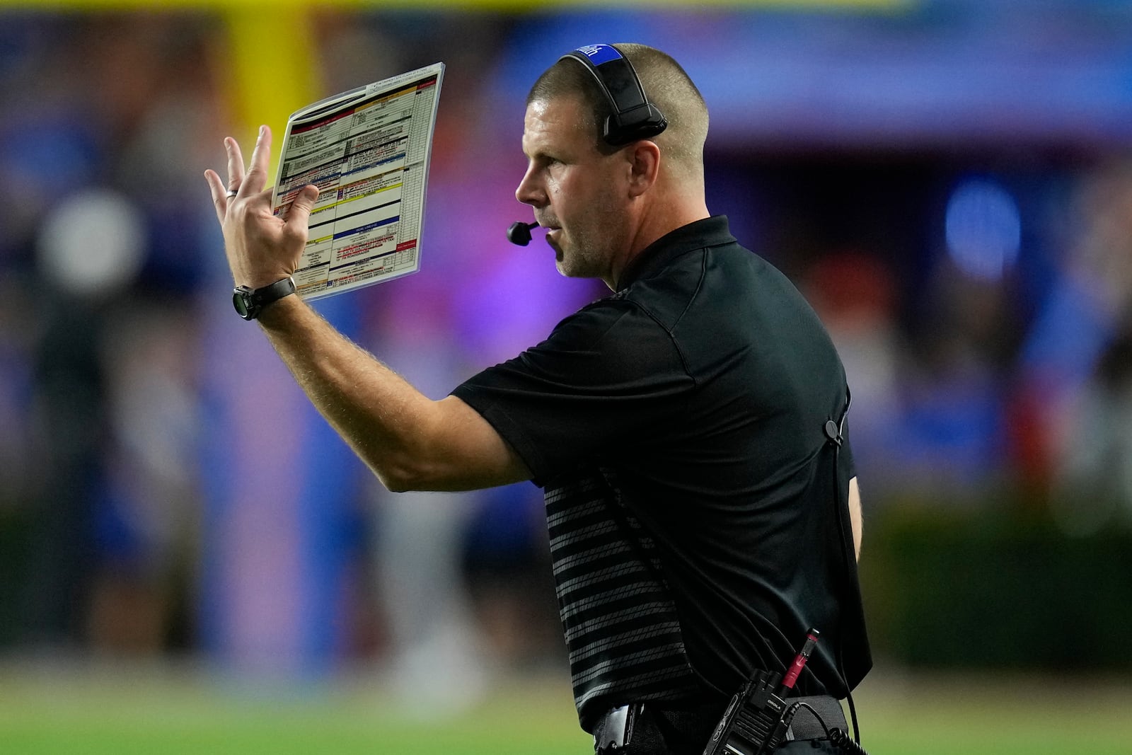 Florida head coach Billy Napier signals to his players during the first half of an NCAA college football game against Central Florida, Saturday, Oct. 5, 2024, in Gainesville, Fla. (AP Photo/John Raoux)