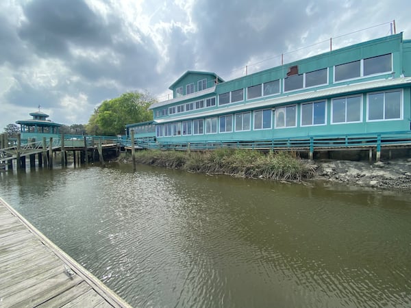 The Fish Dock Bar & Grill in Townsend offers beautiful views of the Sapelo River. Glass windows separating the restaurant from the adjacent Sapelo Sea Farm processing facility provide a glimpse of how seafood is sized and graded. LIGAYA FIGUERAS / LIGAYA.FIGUERAS@AJC.COM