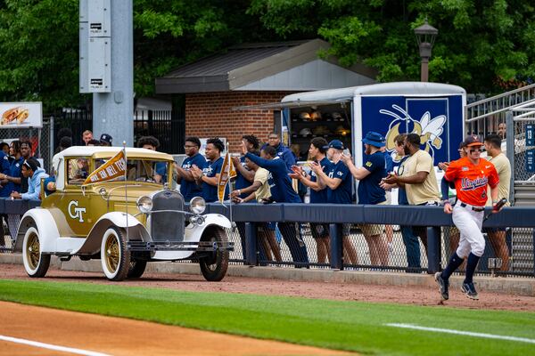 Georgia Tech baseball great Mark Teixeira rides in the rumble seat of the Ramblin' Wreck on Saturday, May 20, 2023. Tech retired Teixeira's jersey No. 23 in a ceremony before the Yellow Jackets played Virginia at Russ Chandler Stadium. (Photo by Eldon Lindsay/Georgia Tech Athletics)