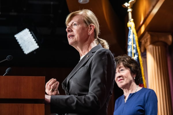 Sen. Tammy Baldwin, (D-Wis.), joined at right by Sen. Susan Collins (R-Maine), speaks to reporters following Senate passage of the Respect for Marriage Act, at the Capitol in Washington on Nov. 29, 2022.(Haiyun Jiang/The New York Times)