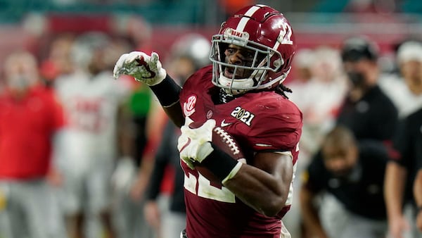 Alabama running back Najee Harris scores a touchdown against Ohio State during the first half of the College Football Playoff championship game, Monday, Jan. 11, 2021, in Miami Gardens, Fla. (Chris O'Meara/AP)