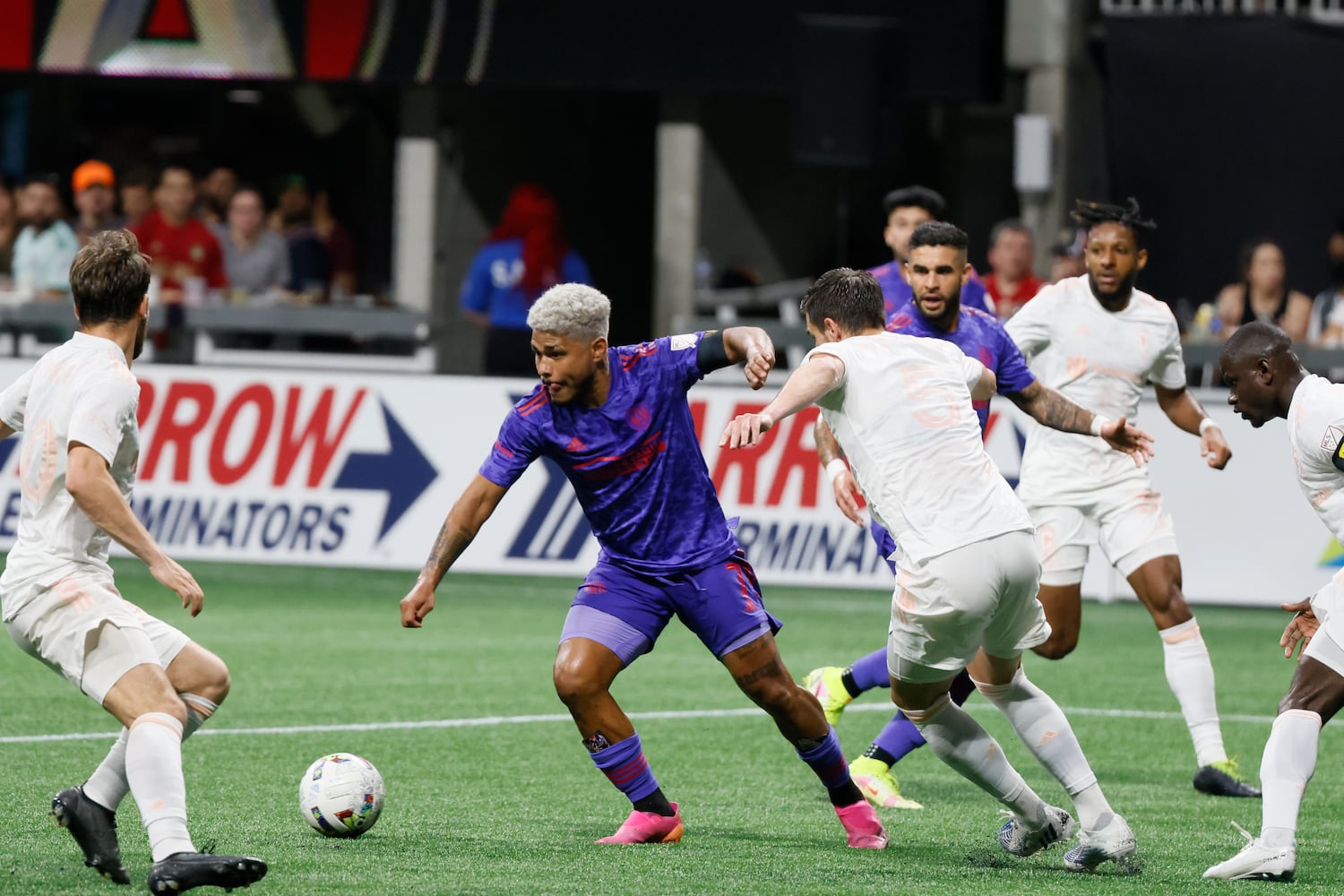 Atlanta United forward Josef Martinez gets past Columbus Crew defenders in the second half of an MLS soccer match at Mercedes-Benz Stadium on Saturday, May 28, 2022. Miguel Martinez / miguel.martinezjimenez@ajc.com