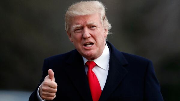 President Donald Trump gives thumbs up as he walks to the White House after arriving on Marine One, Sunday, March 19, 2017, in Washington. Trump is returning from a trip to his Mar-a-Lago estate in Palm Beach, Fla. (AP Photo/Alex Brandon)