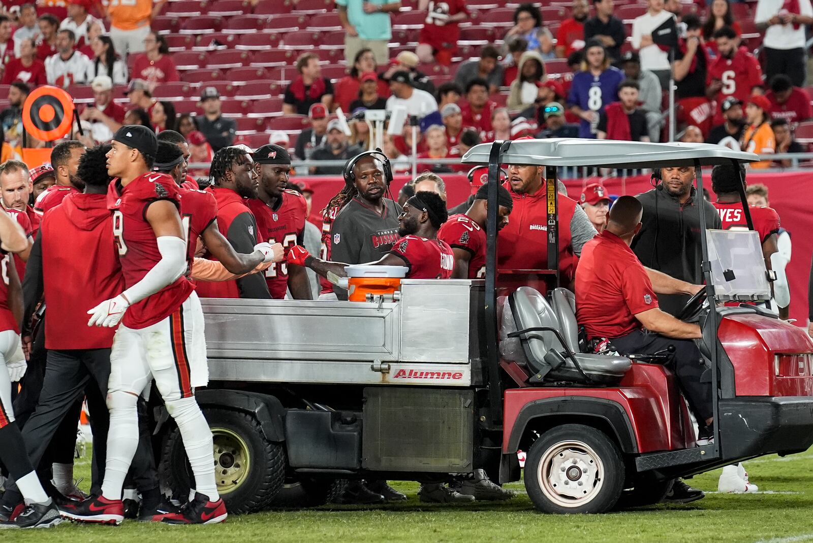 Tampa Bay Buccaneers wide receiver Chris Godwin (14) interacts with his teammates while being carted off of the field after an injury during the second half of an NFL football game against the Baltimore Ravens, Monday, Oct. 21, 2024, in Tampa, Fla. (AP Photo/Chris O'Meara)