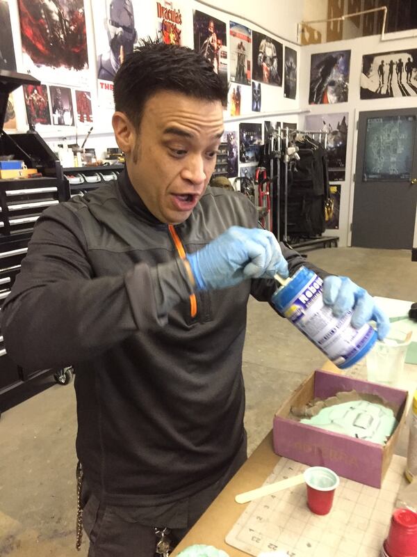 Eric Anthony Leong at Southeast Plastic Forming creating guns for a local TV show. CREDIT: Rodney Ho/ rho@ajc.com