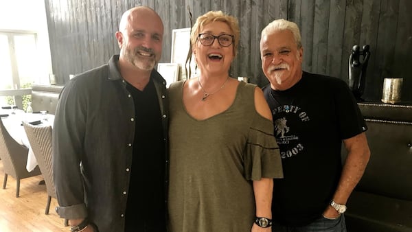 Restaurateur Justin Anthony (left) with his parents, Diane and Derek Anthony. The couple has worked at 10 Degrees South since it opened in 1998.  LIGAYA FIGUERAS / LFIGUERAS@AJC.COM