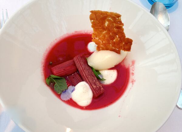 Poached rhubarb in a strawberry verbena soup with lemon sorbet