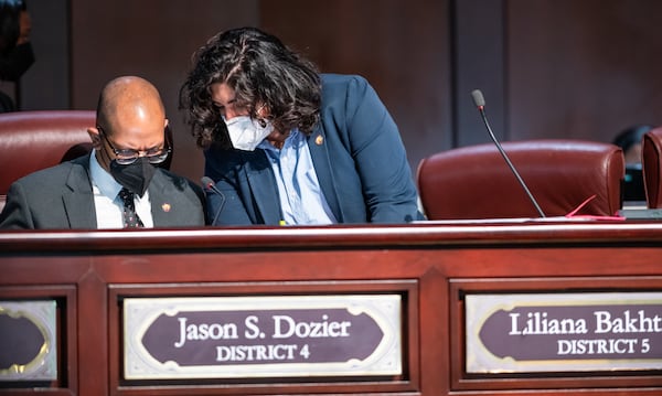 Atlanta City Councilmembers Jason Dozier (left) and Liliana Bakhtiari convene during the council's in-person meeting at City Hall on March 7, 2022. (Atlanta City Council Office of Communications)