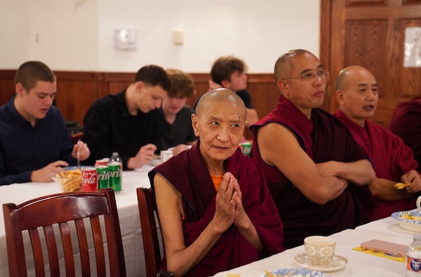 Monks and high school students attend the 18th birthday and enthronement ceremony for U.S.-born Buddhist lama, Jalue Dorje, in Isanti, Minn., on Saturday, Nov. 9, 2024. (AP Photo/Jessie Wardarski)