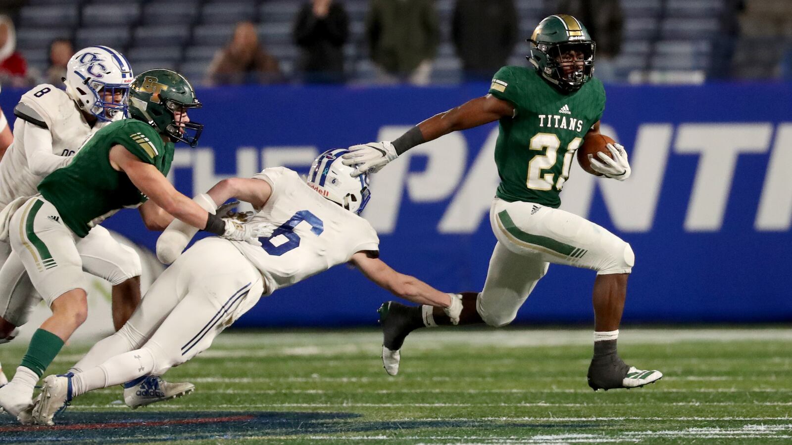 Blessed Trinity running back Elijah Green (21) gets by Oconee County defensive back Liam Lewis (6) for Green's second touchdown in the first half of the Class AAAA state title game Saturday, Dec. 14, 2019, at Georgia State Stadium in Atlanta.