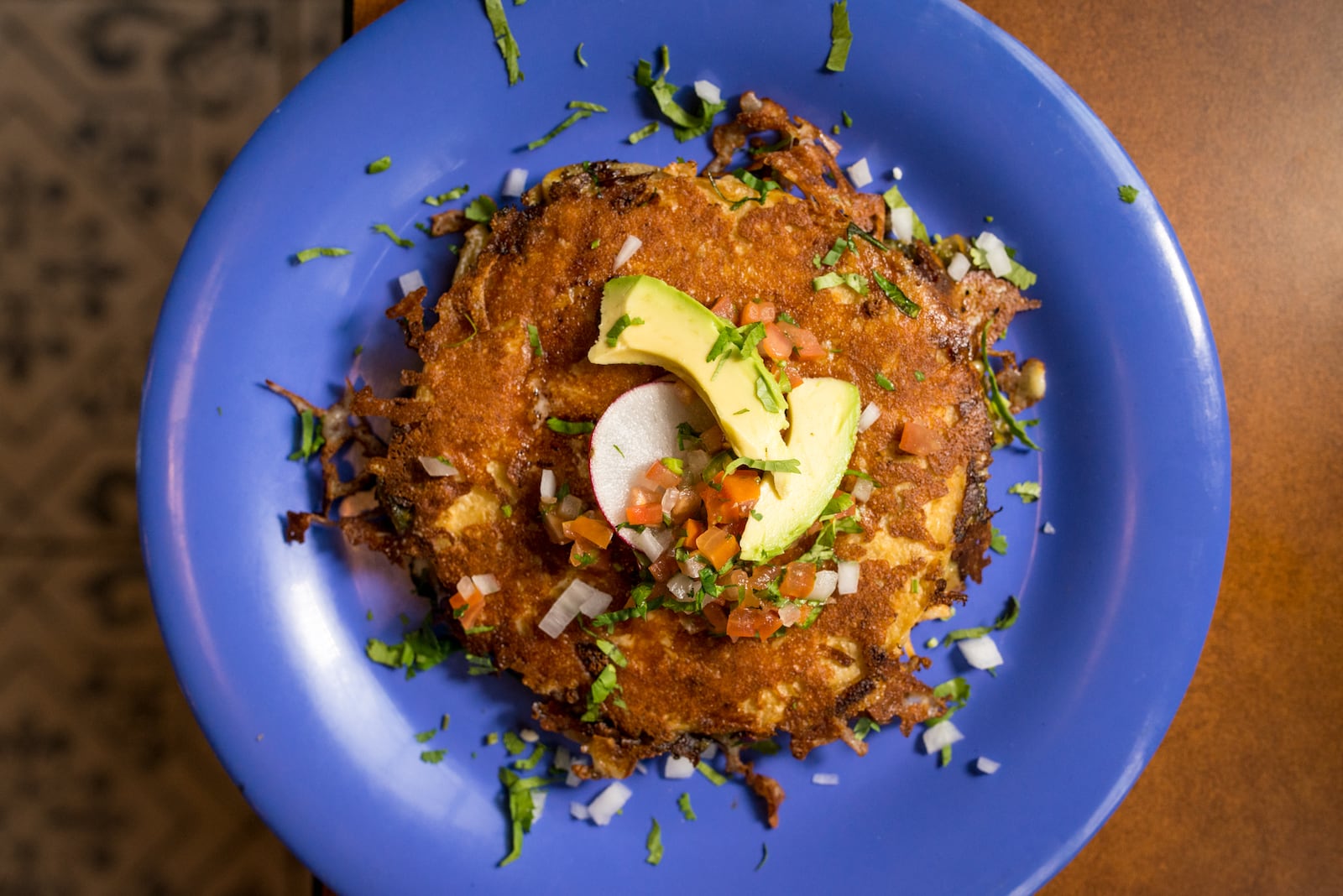 Taqueria el Tesoro Tinga de Pollo Multia, two handmade corn tortillas with rajas and filling, griddled queso chihuahua, and crema.