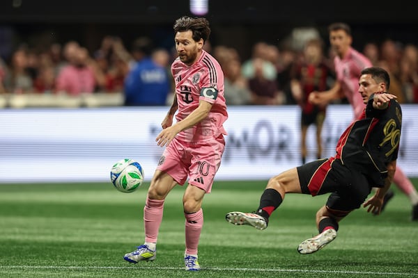 Inter Miami forward Lionel Messi (10) gets ready to kick the ball after getting past Atlanta United midfielder Bartosz Slisz (99) during the first half of an MLS soccer match, Sunday, March, 16, 2025, in Atlanta. (AP Photo/Colin Hubbard)