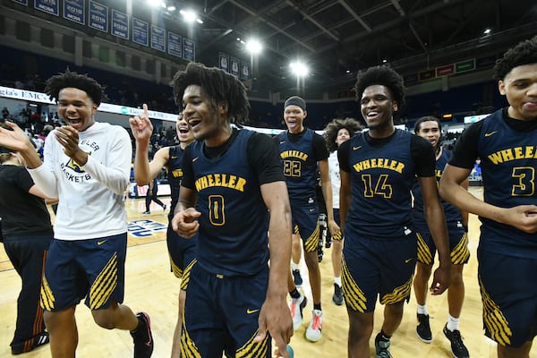 Wheeler High School players celebrate their weekend playoff win over Grayson.